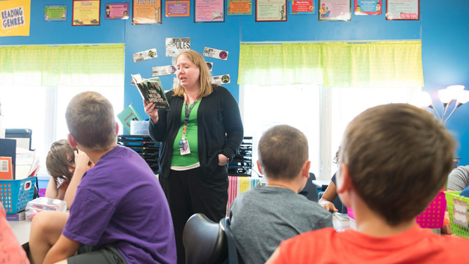A teacher reading to students.