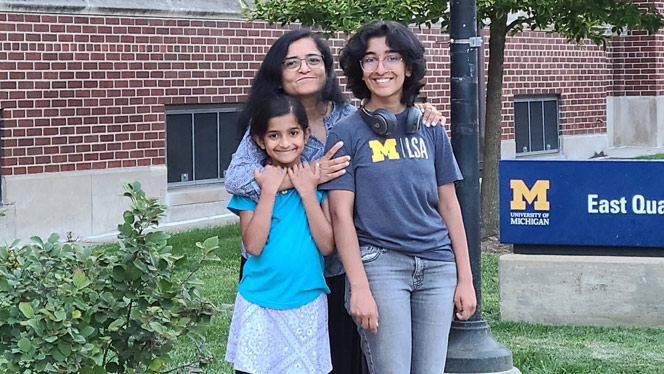 Divya C. with her sister and mother.