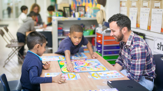 teacher playing a game with students
