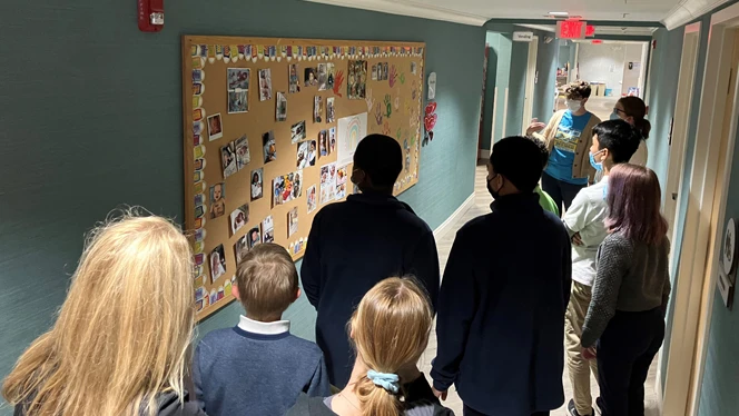 People gathered in the hallway. People gathered in the hallway.