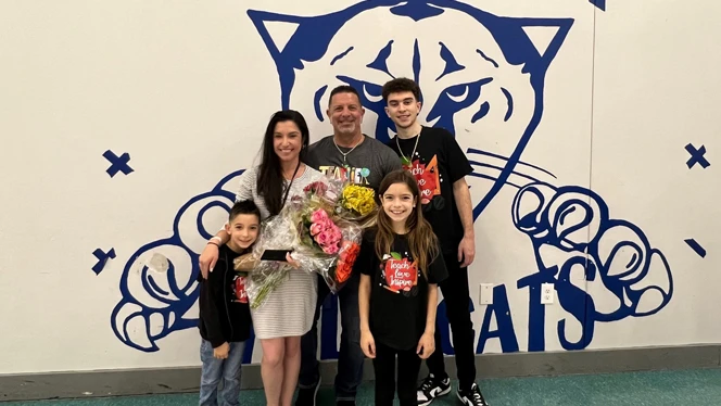 Rachel Licata smiling with family.