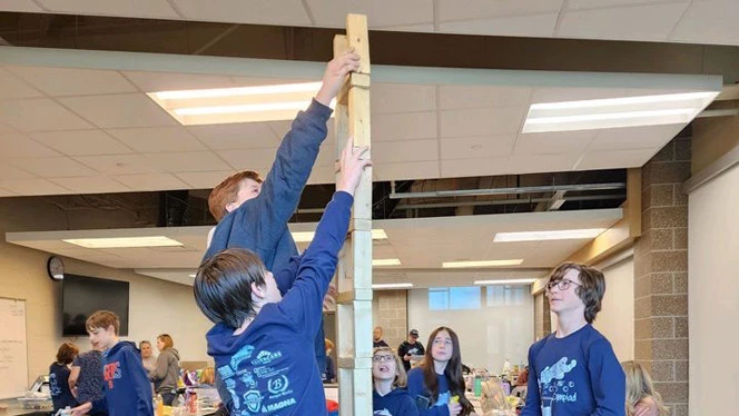 Students playing Jenga in between events