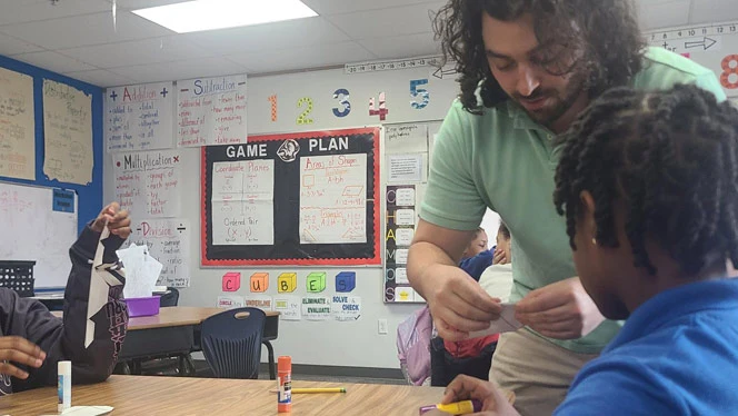 Treu teaching math at Buffalo United Charter School
