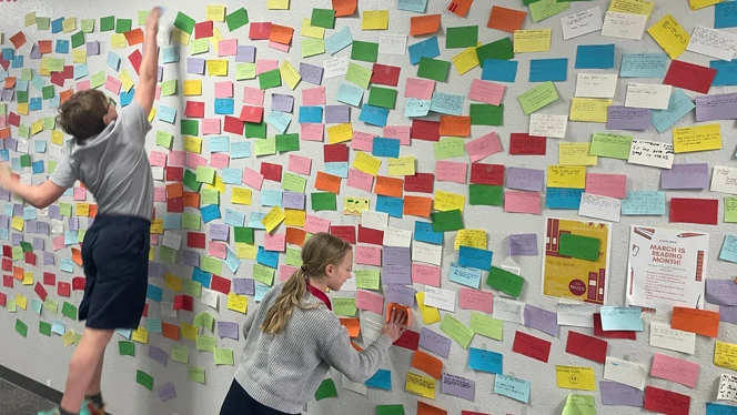 Students adding to the affirmation wall. Students adding to the affirmation wall.