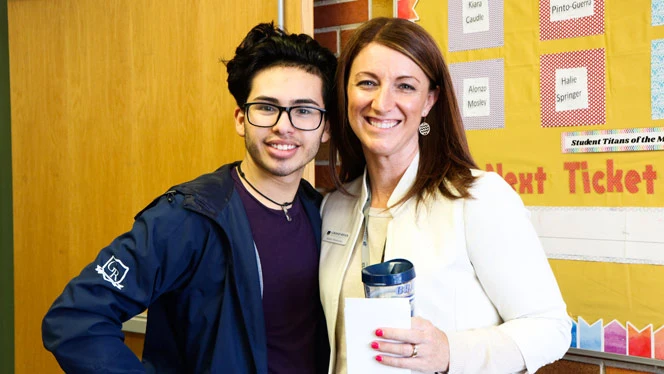 Koree Woodward smiling with a teen. Koree Woodward smiling with a teen.