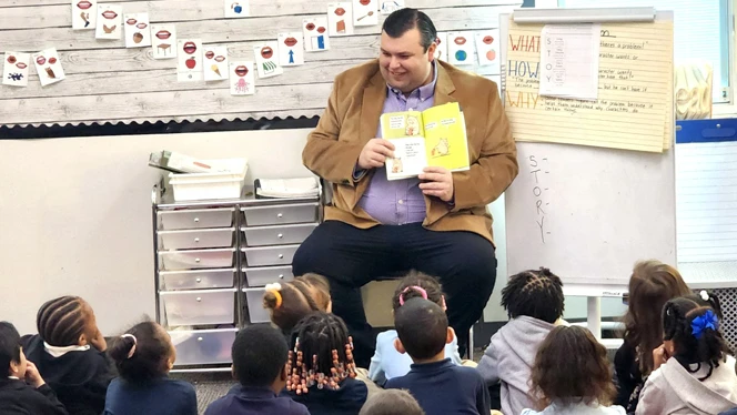 K-8 School in Muskegon: State Representative Will Snyder reads to Timberland Charter Academy scholars.
