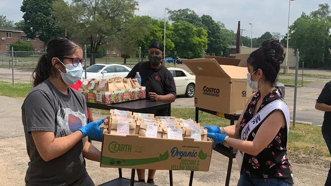 Women delivering food bags