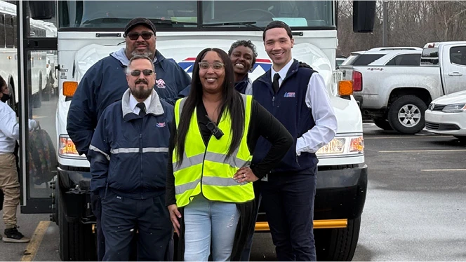 K-8 School in Flint: Linden Charter Academy's liaison poses with bus drivers.