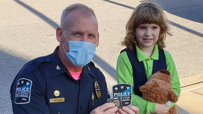 Clayton police officer with Johnston student