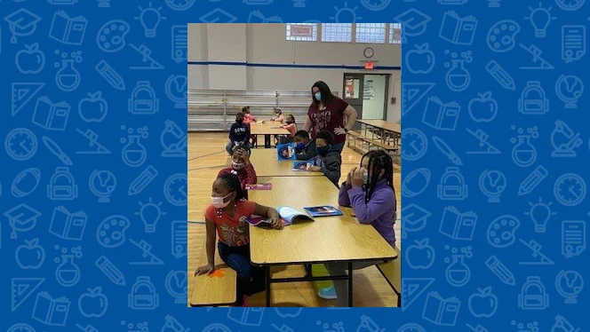 students working on their book