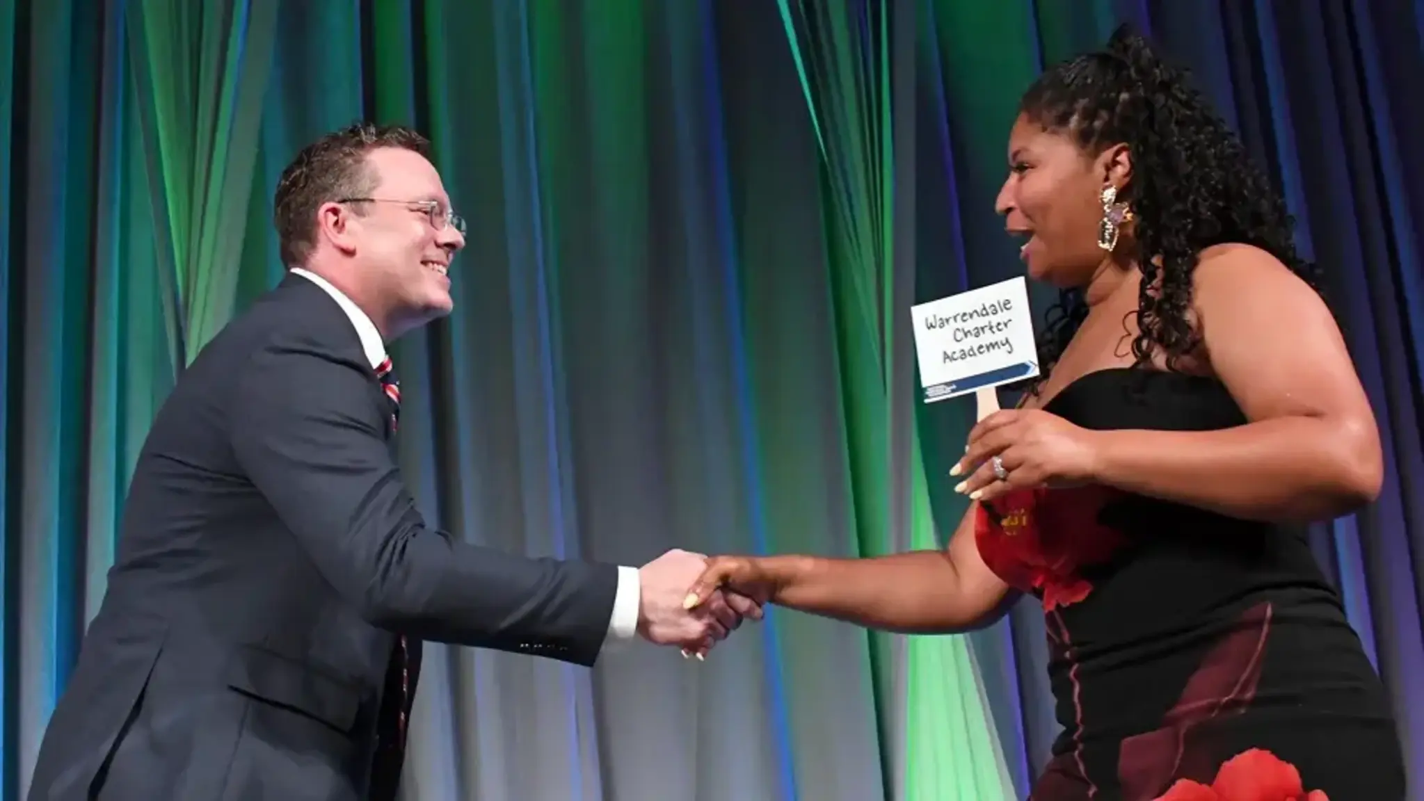 a man and woman shaking hands