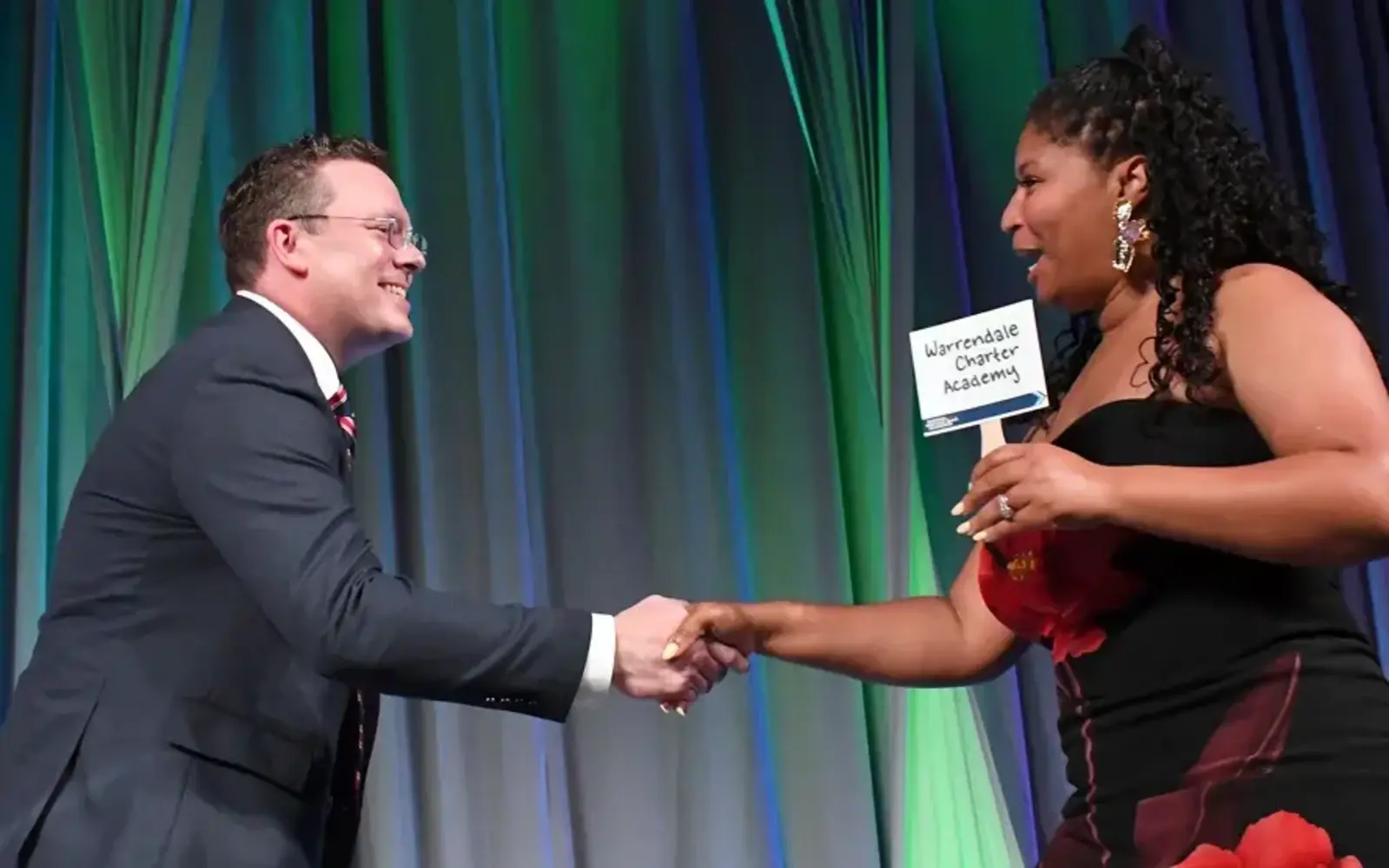 a man and woman shaking hands