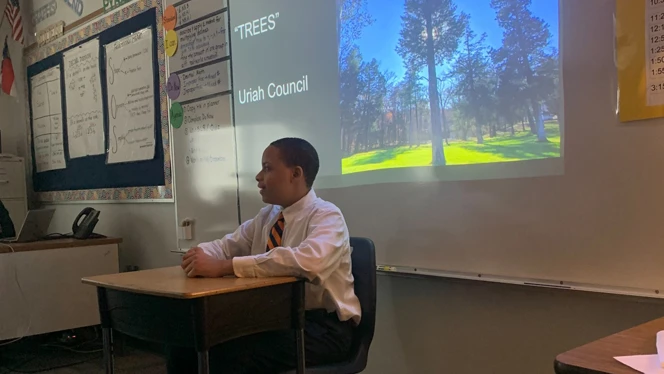 A student recites his poem