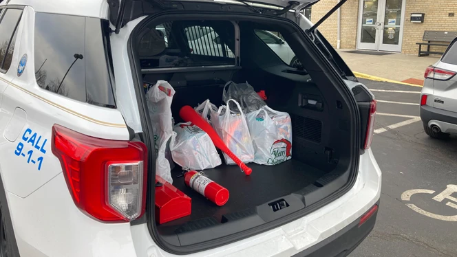 Police cruiser filled with presents. Police cruiser filled with presents.