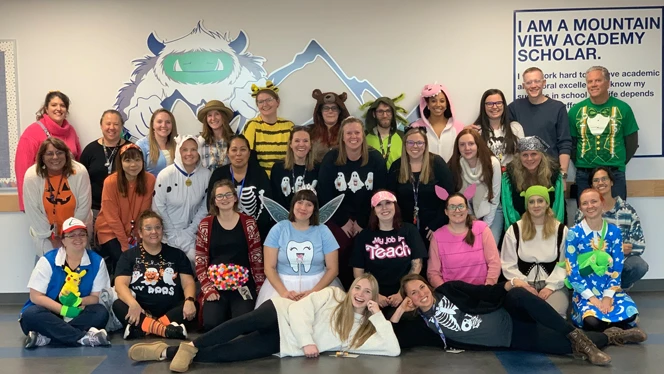 Teachers in Halloween costumes.