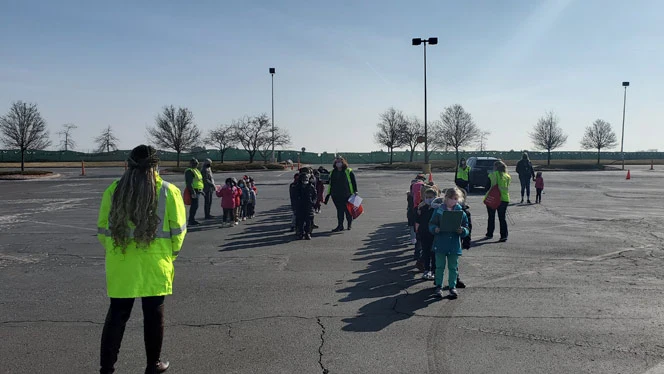 Children lined up outside. Children lined up outside.
