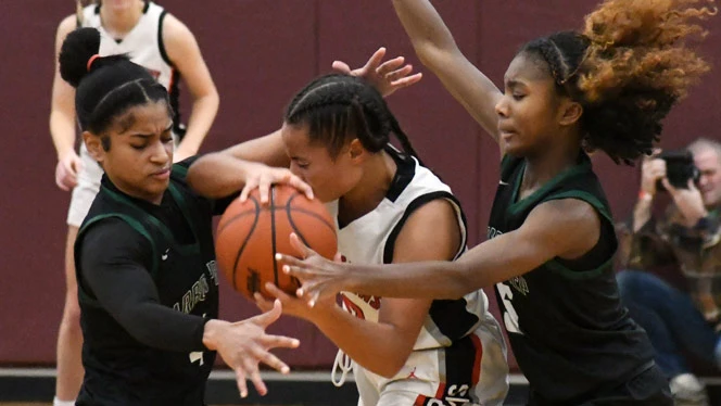 Pernell and Wallace guard a player