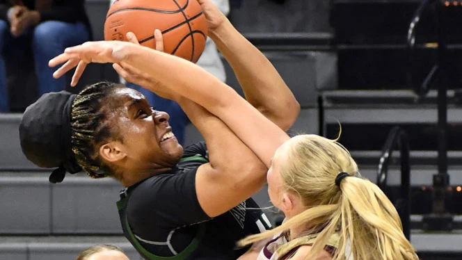 Stacy Utomi shooting the ball