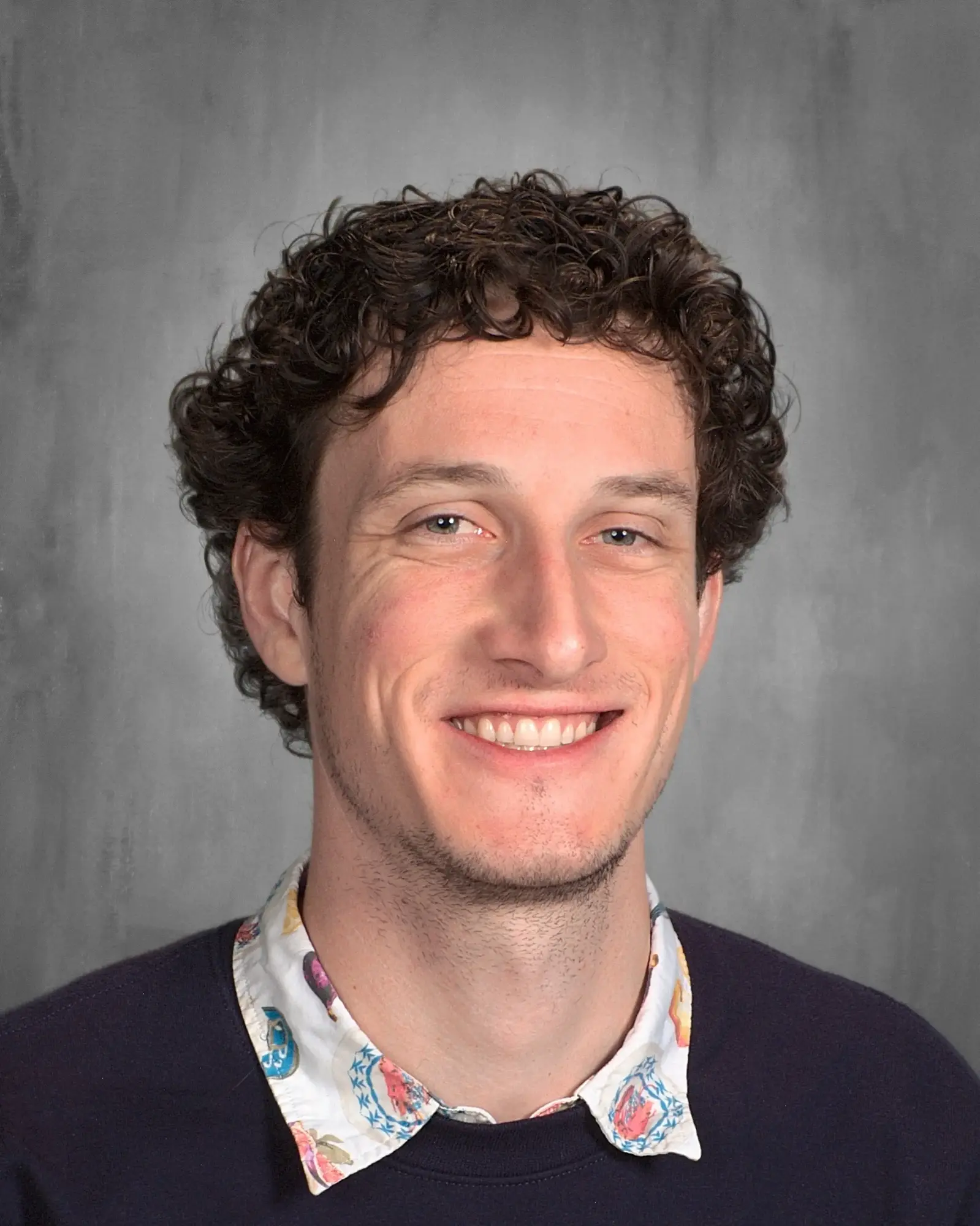 a man smiling for a picture