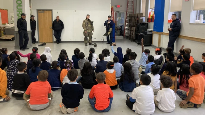 Fire department talking with class about safety.