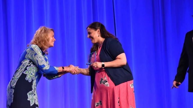Two woman shaking hands. Two woman shaking hands.