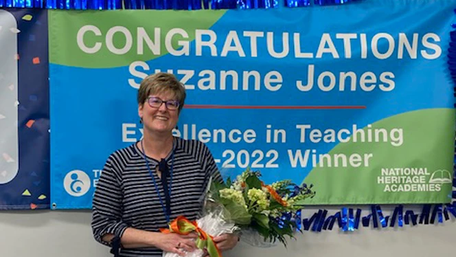 Suzanne Joes posing with award.