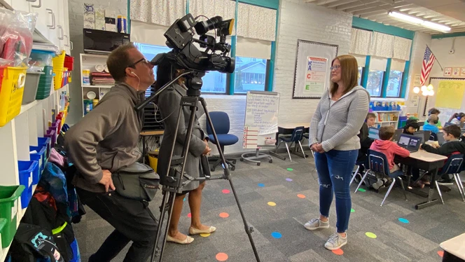 Becky Heneveld speaking to a camera. Becky Heneveld speaking to a camera.