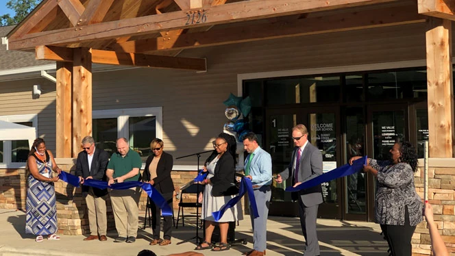 Cutting the ribbon. Cutting the ribbon.