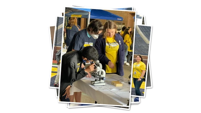 East Arbor student looks through a microscope