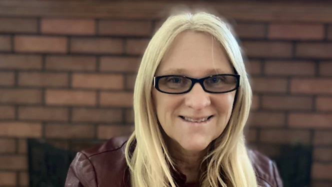 Suzanne Price smiling. Suzanne Price smiling.