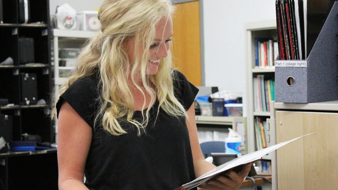 A woman reading music. A woman reading music.