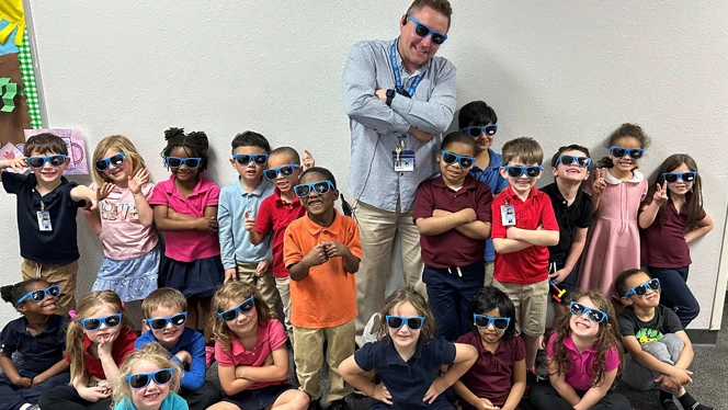 Students wearing sunglasses and posing. Students wearing sunglasses and posing.