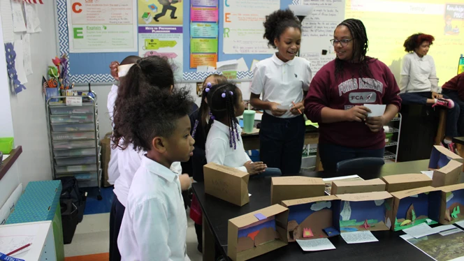 students presenting their dioramas