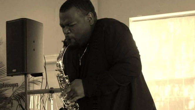 Page playing saxophone.