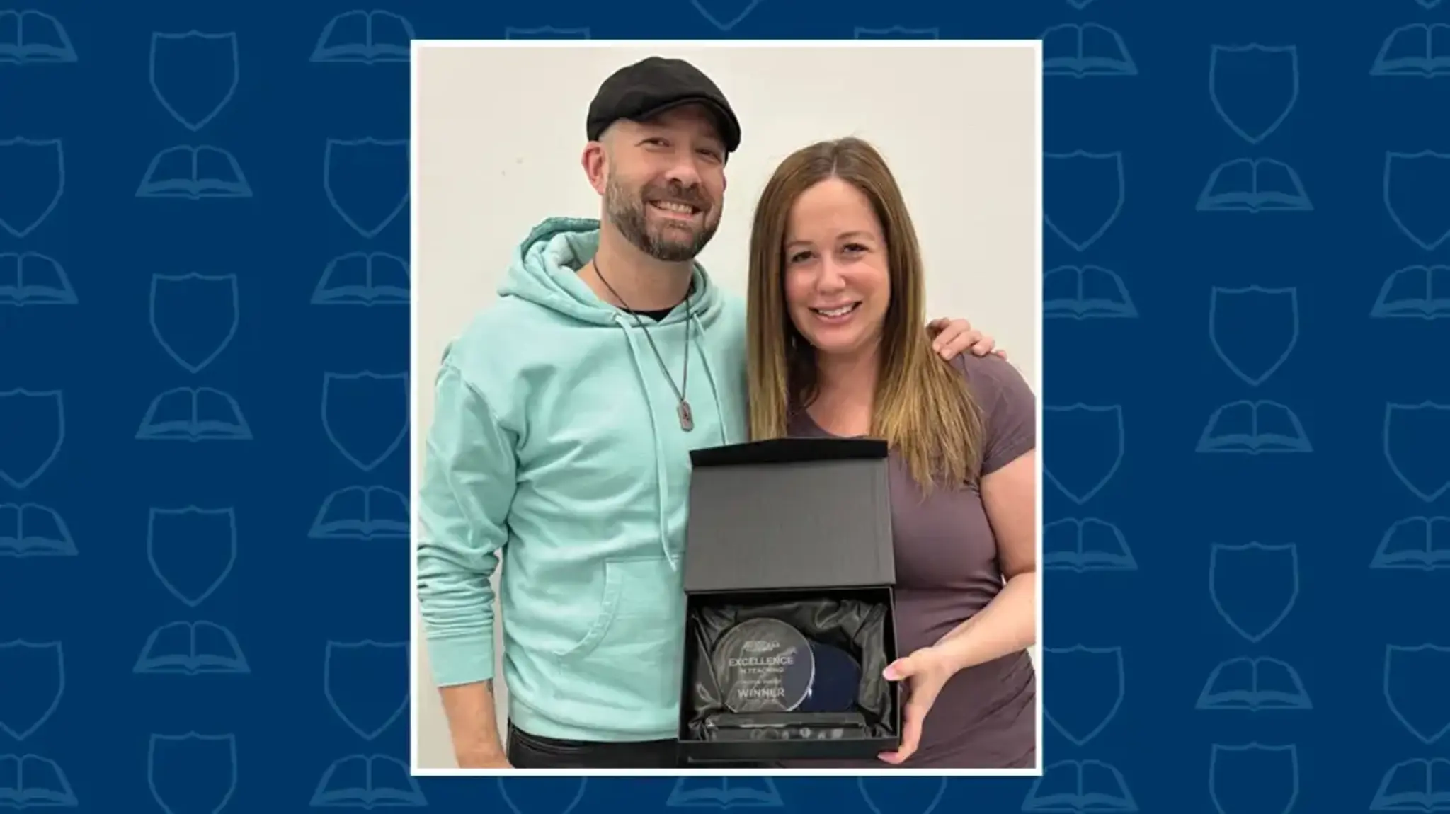 a man and woman holding a award