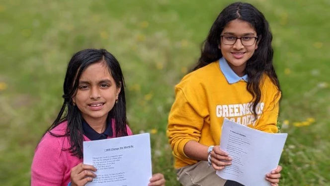 Greensboro students with their essays