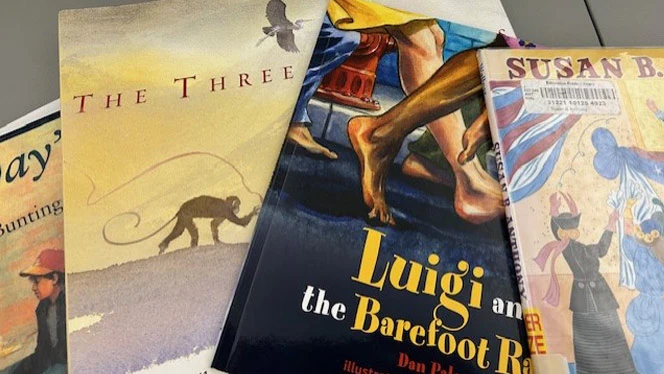 Multiple books laying on table
