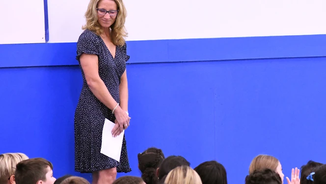Principal looking down at group of students