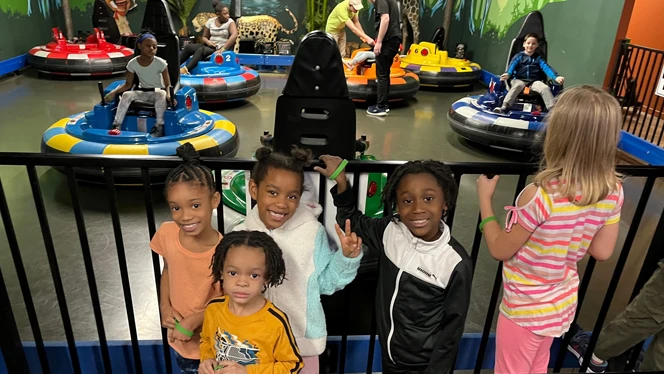 Students playing bumper cars.