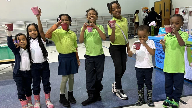 Detroit Enterprise students with their painted pots.