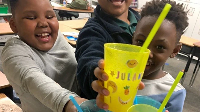 Students with personalized cups