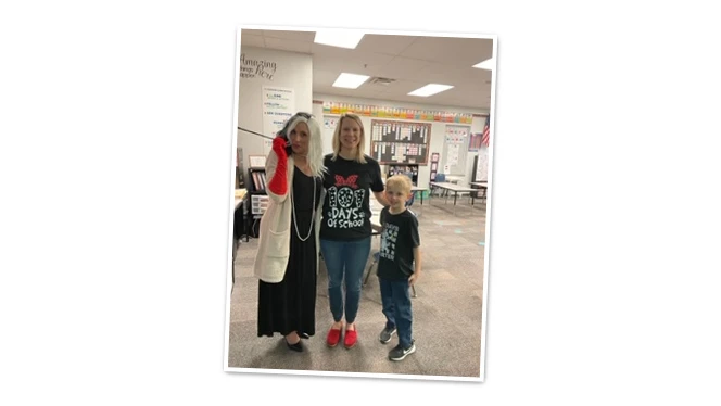 Brittany Houston poses with teacher and student.
