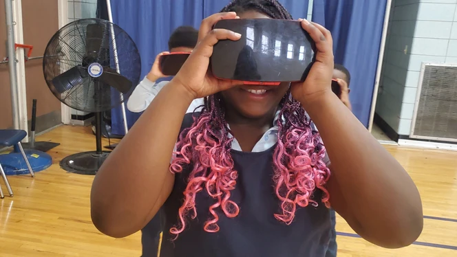 Student with VR set.