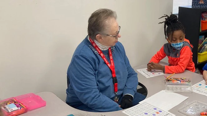 Pat Colunga working with a student.