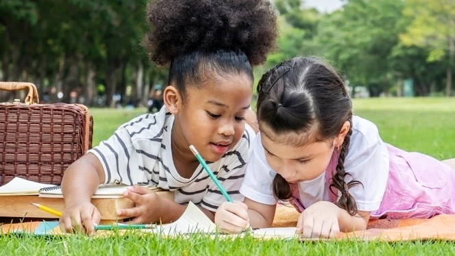 Children writing in journal
