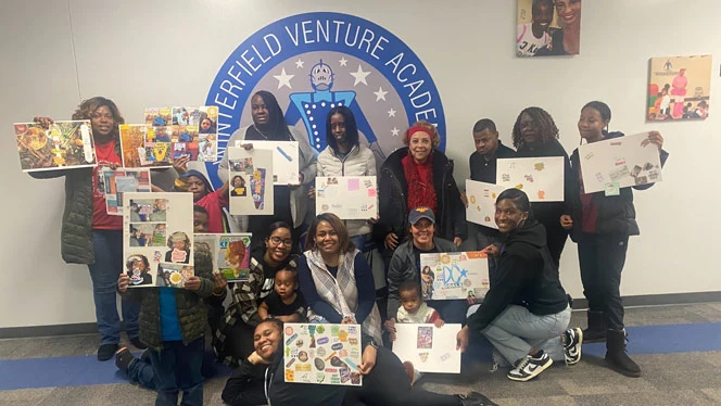 Participants at the event show off their vision boards.