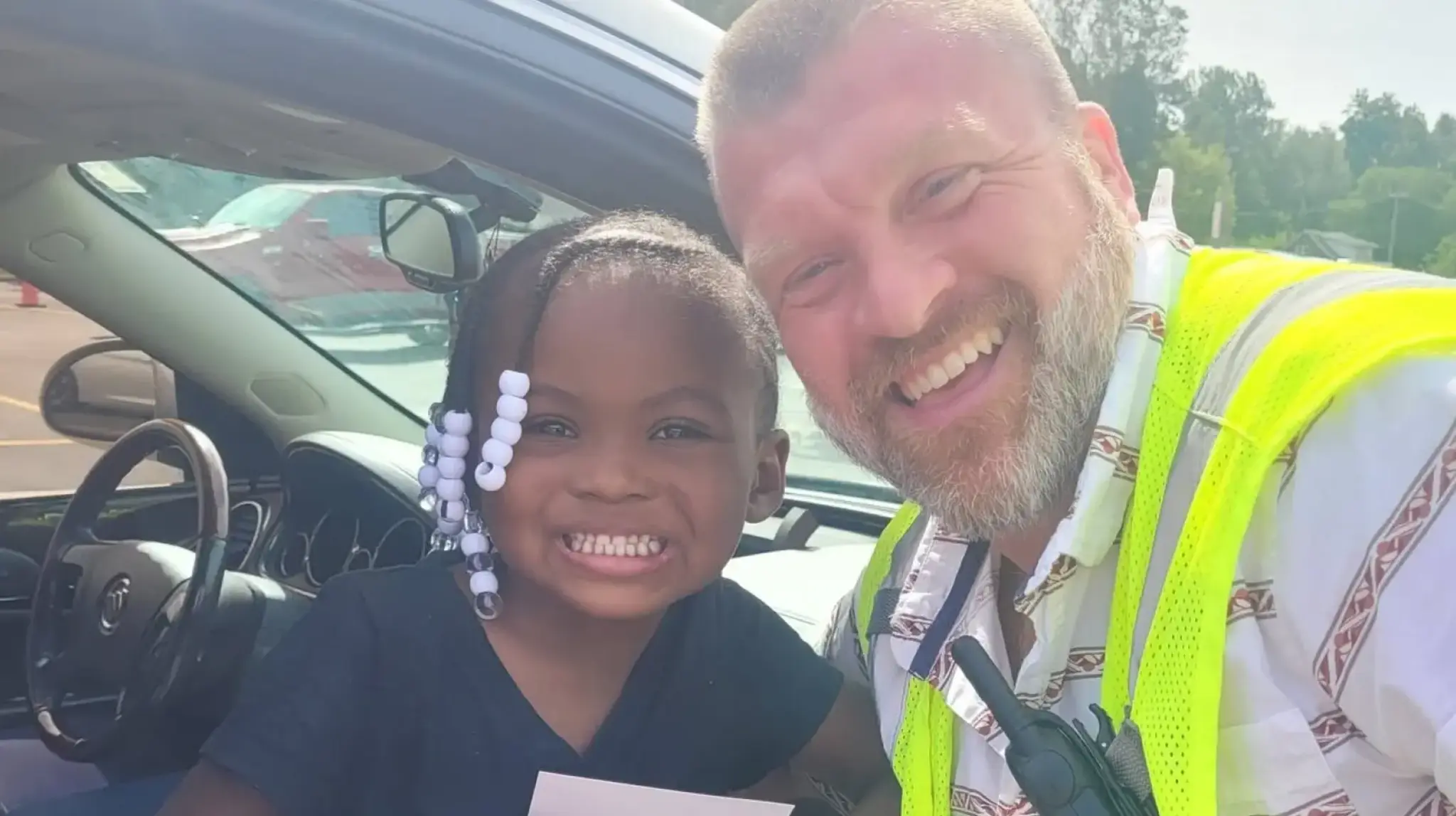 a man and child in a car