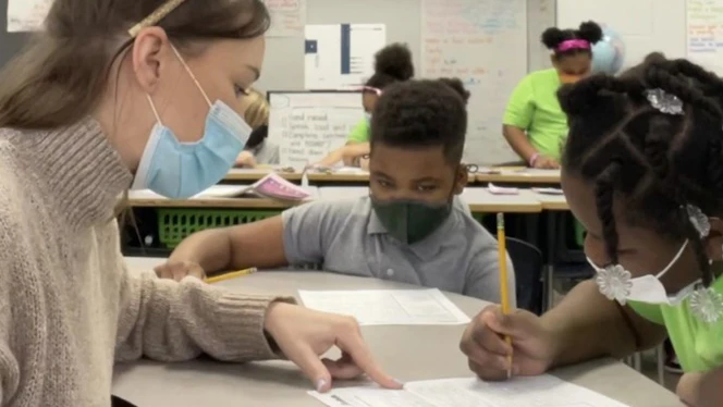 Jessica Lollie works with students