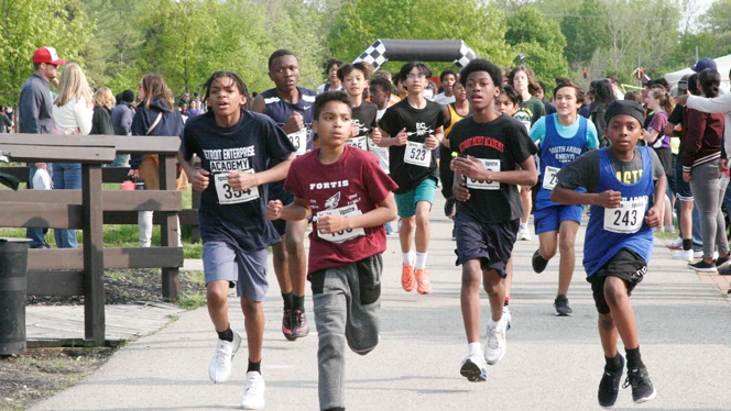 A group of boys running. A group of boys running.