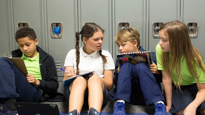 Students working in hallway.